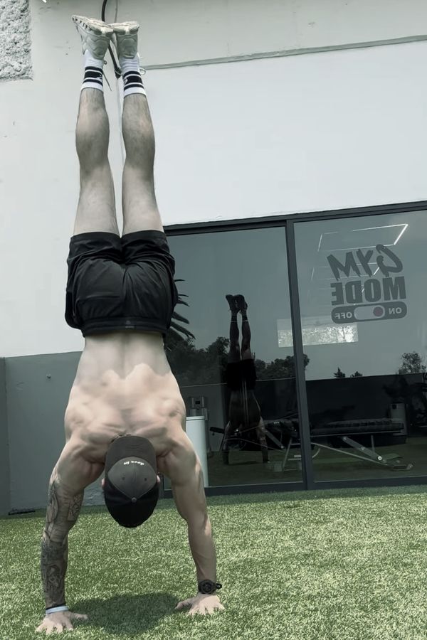 Handstand on turf outside a gym