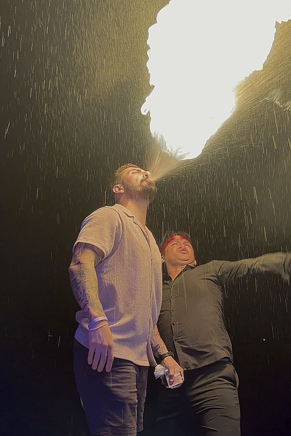 Jared breathing fire at a night show